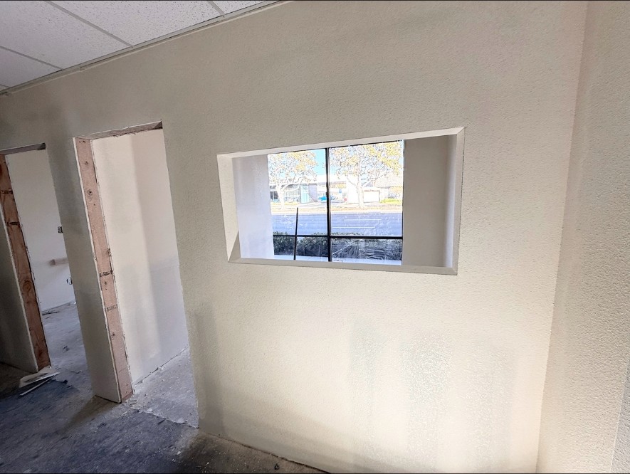 Finished interior wall with framed window